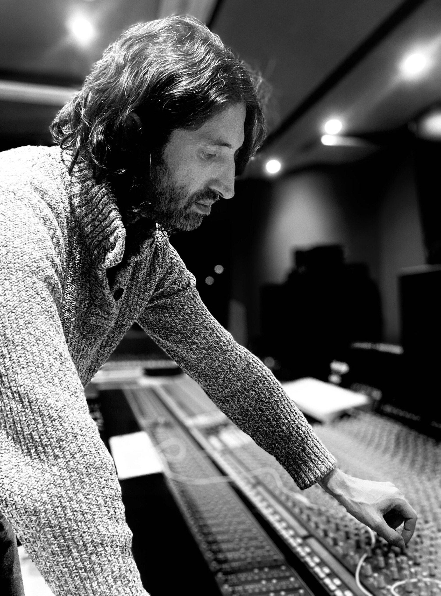 Alex working at the studio mixing console